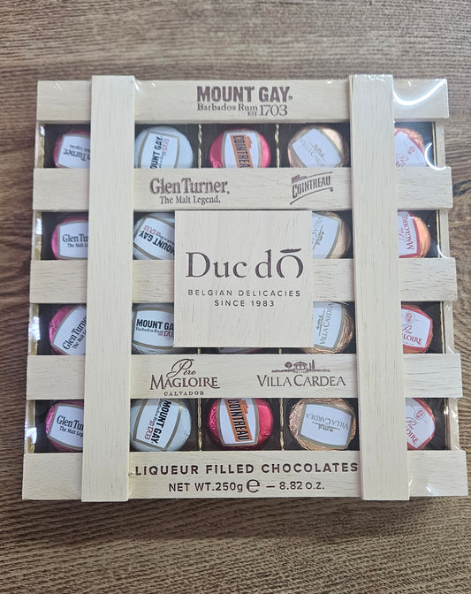 Duc d'O wooden crate of assorted liqueur filled chocolates with sugar crust - 250g