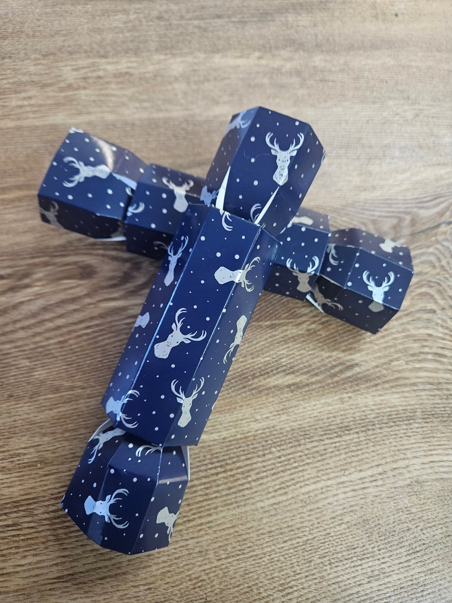 Christmas crackers filled with milk chocolate hazelnut praline santa & white chocolate hazelnut praline snowman